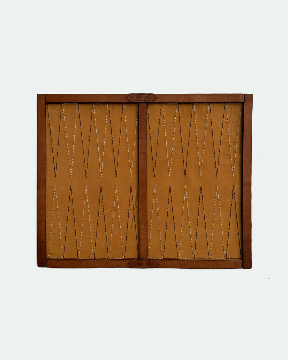 The Drifter 26, a leather backgammon board. Burnt orange leather with cream and dark brown points. View 1.