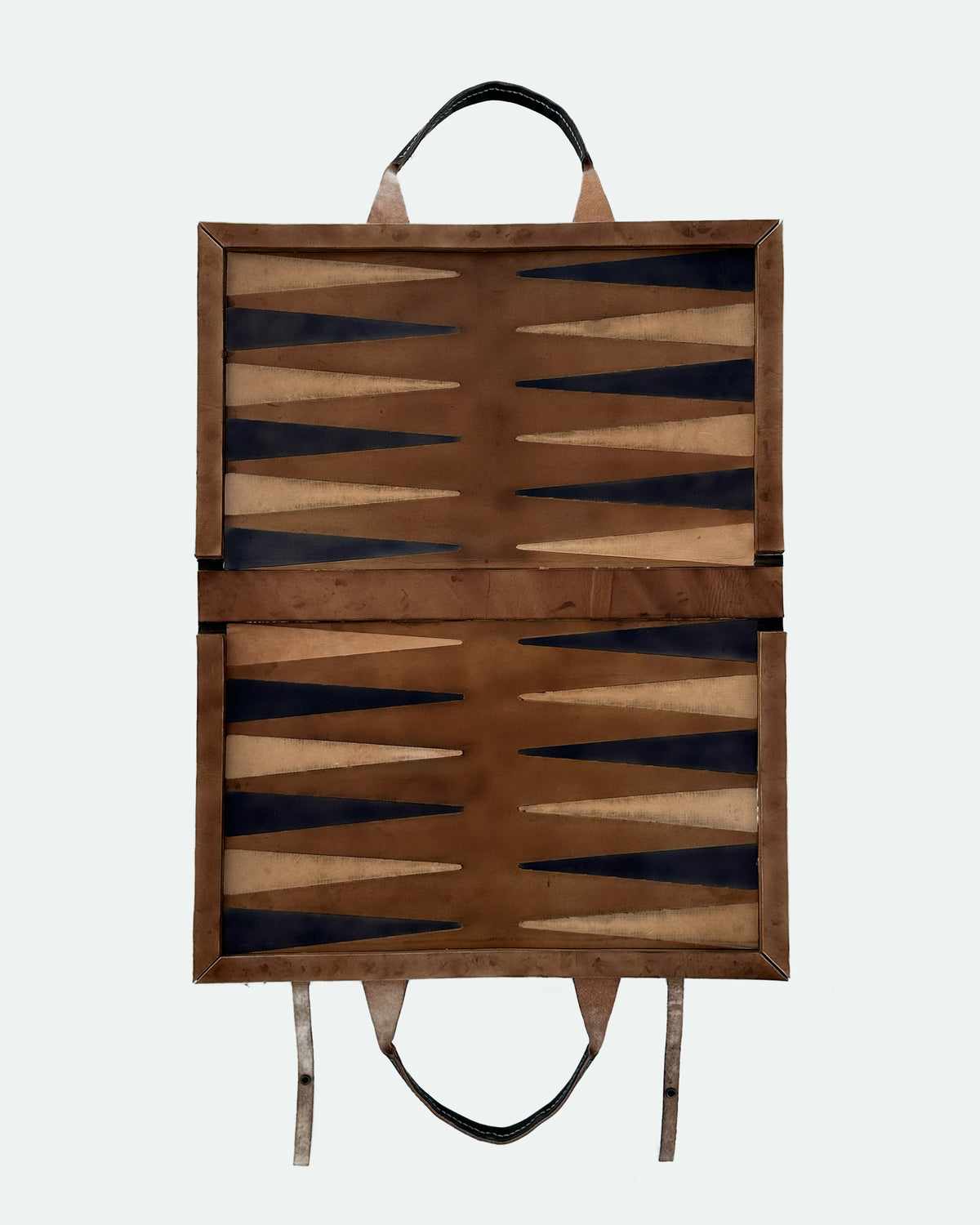 The Drover 26, a leather backgammon board. Show brown leather with black and natural points.