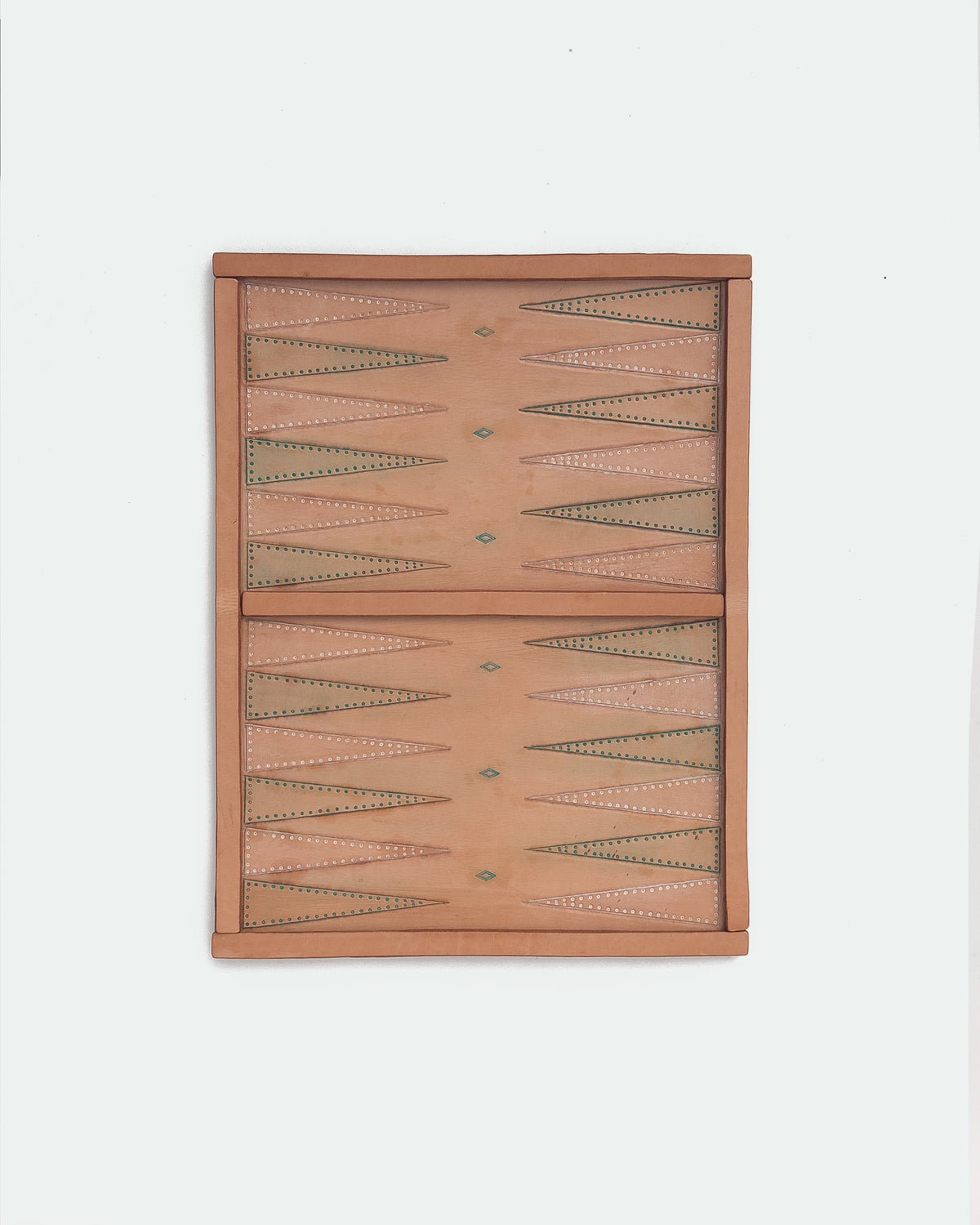 The Drifter 22, a leather backgammon board. Natural leather with turquoise antique and white antique points.