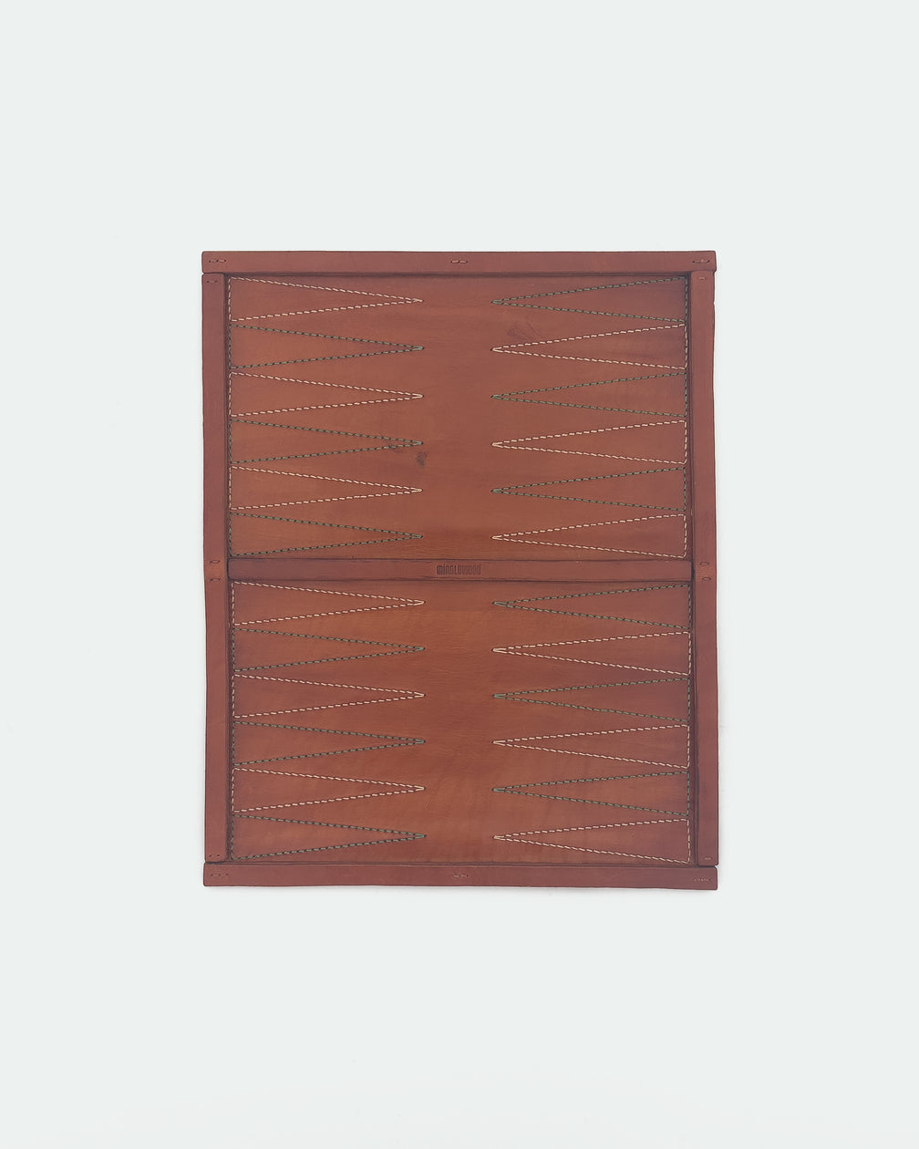 The Drifter 22, a leather backgammon board. Medium brown leather with beige and pea green points. View 1.