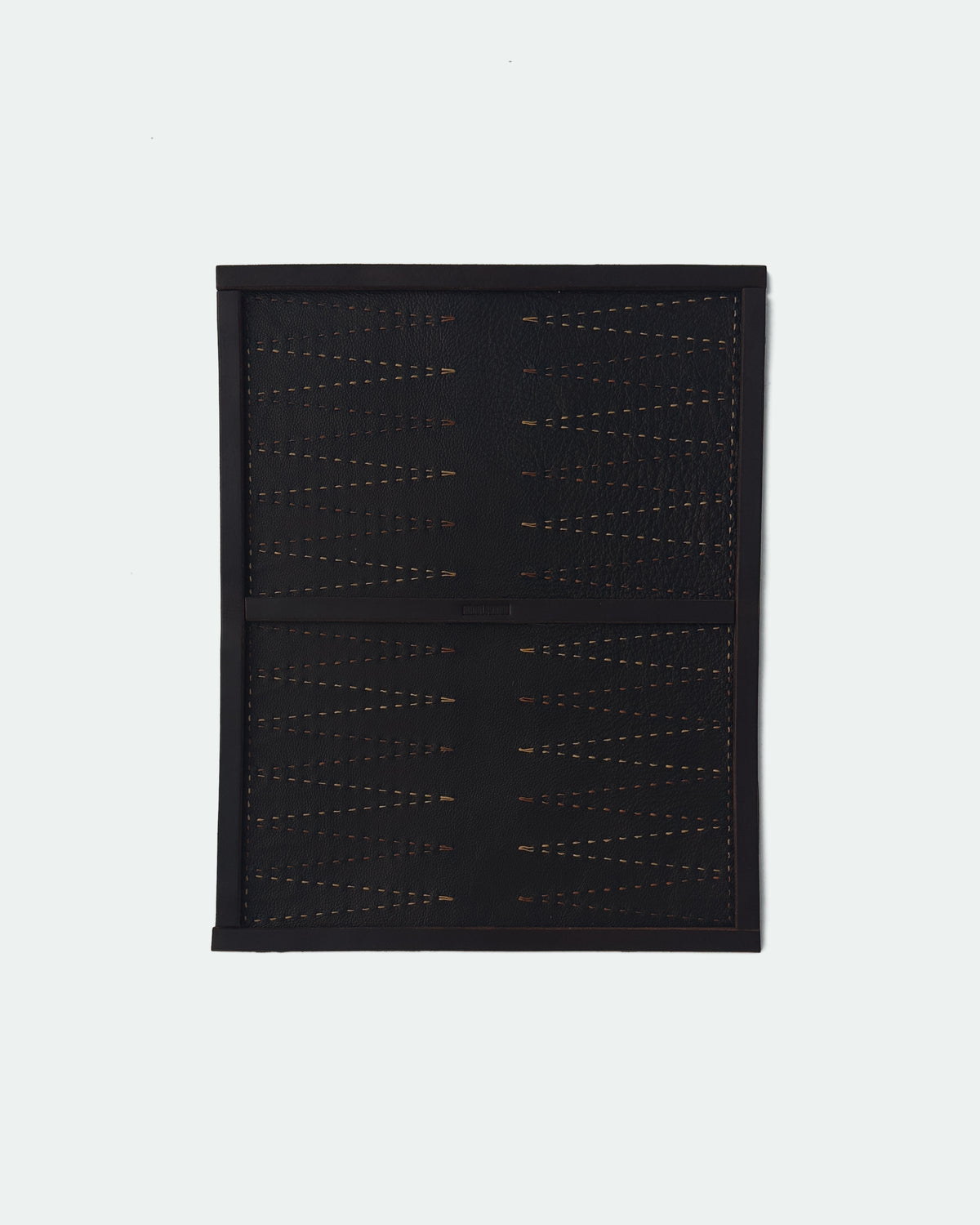 The Drifter 22, a leather backgammon board. Dark brown leather with light brown and medium brown points.