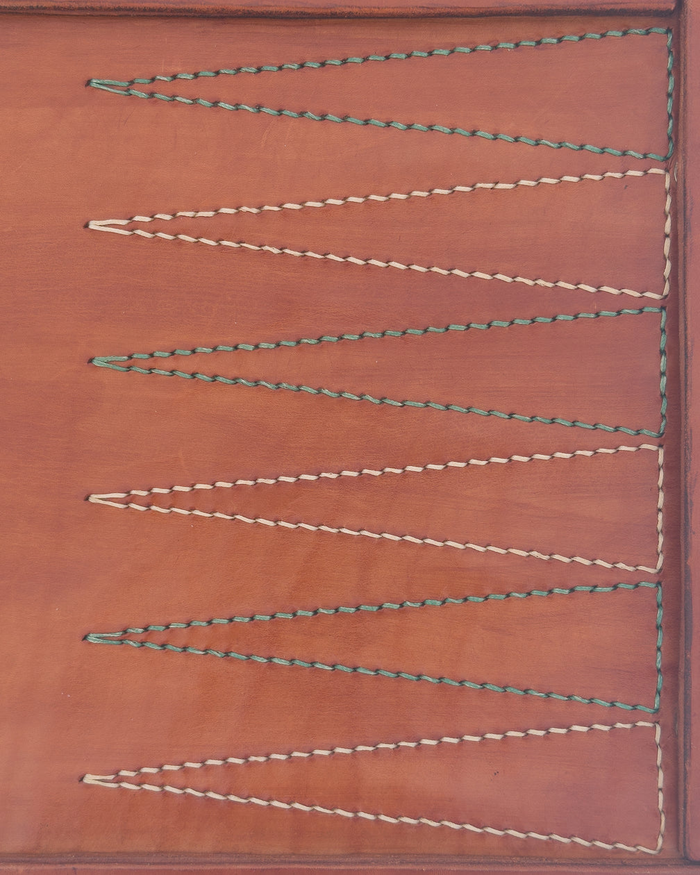 The Drifter 22, a leather backgammon board. Medium brown leather with beige and pea green points. View 5.