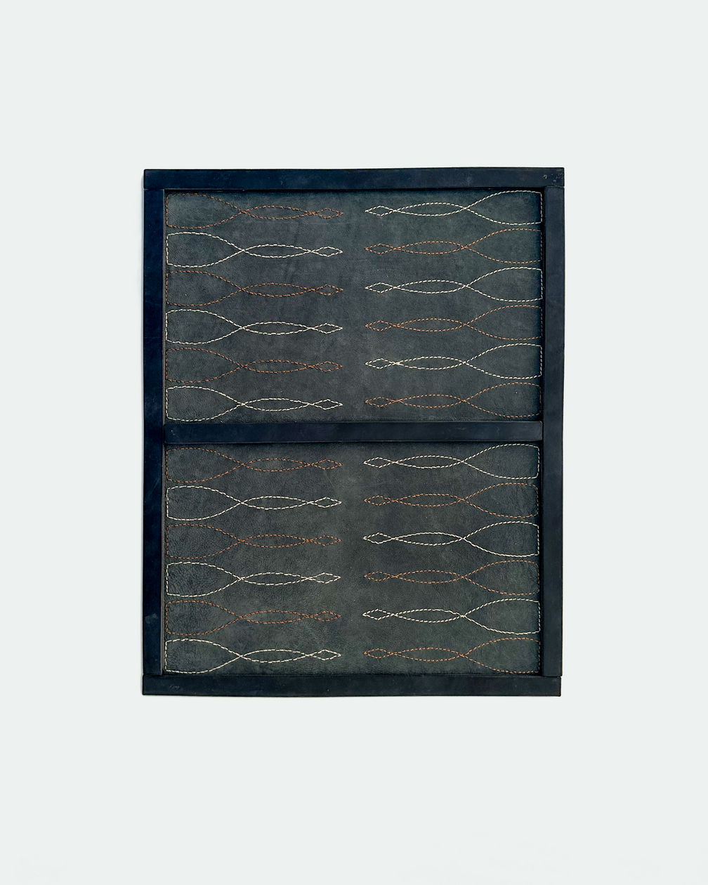 Saddle stitch backgammon board in black leather with Havana cigar and cream stitched points