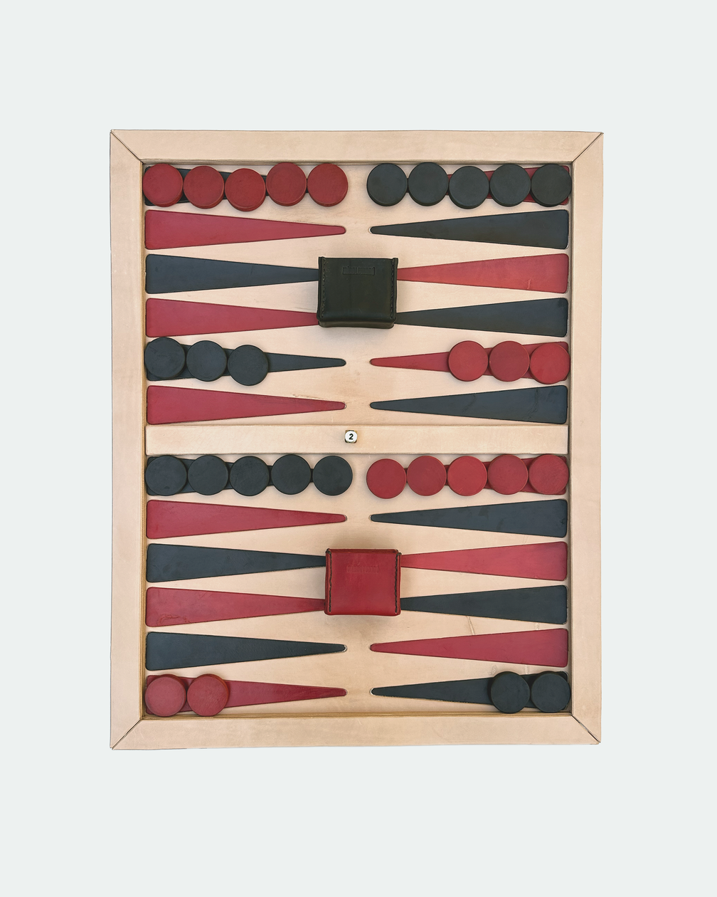 Natural veg-tan backgammon board set up with players, dice cups and doubling cube
