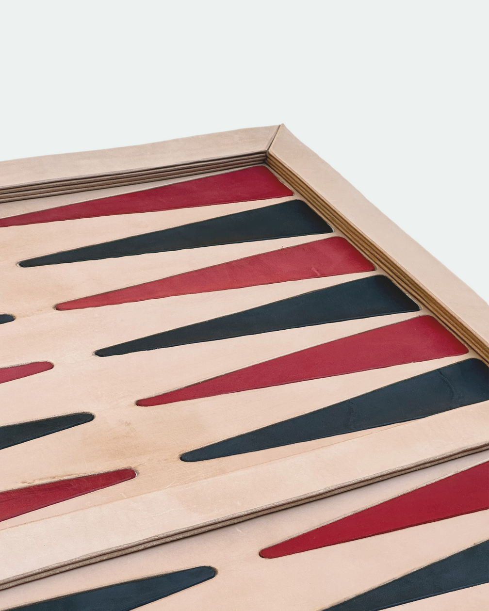 Edge profile of the natural veg-tan inlaid backgammon board
